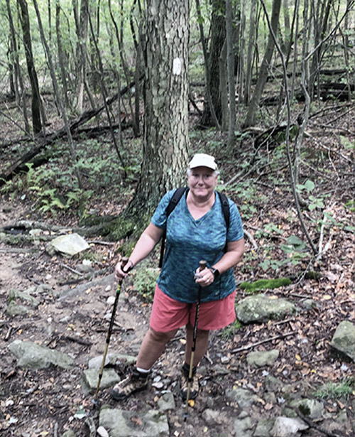 Sandra Marra hiking on the trail