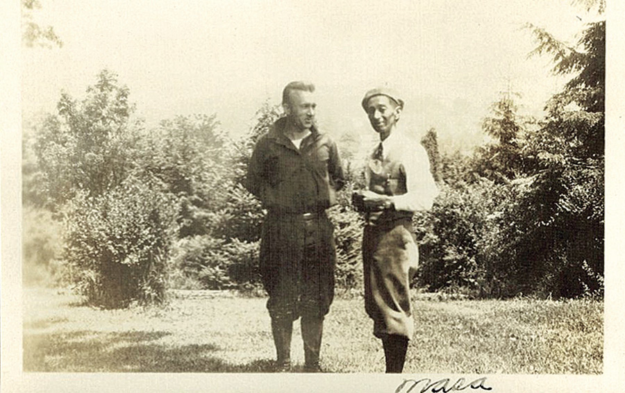 old photograph of two people talking