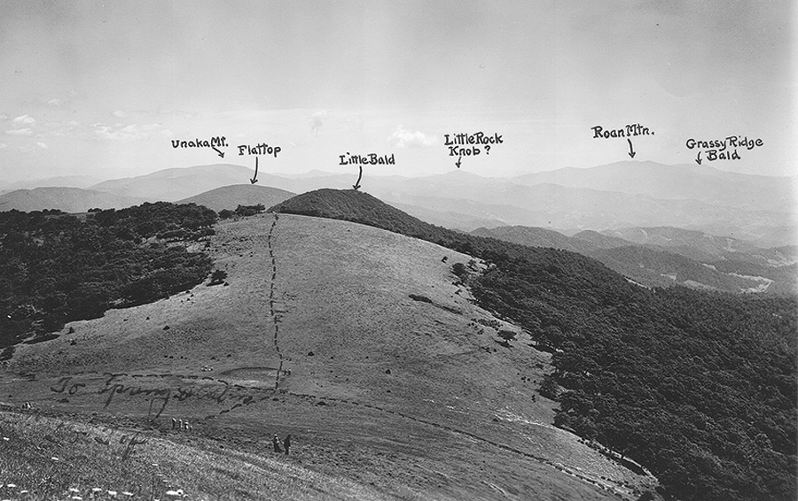 handwritten notes labeling mountains on an old photograph