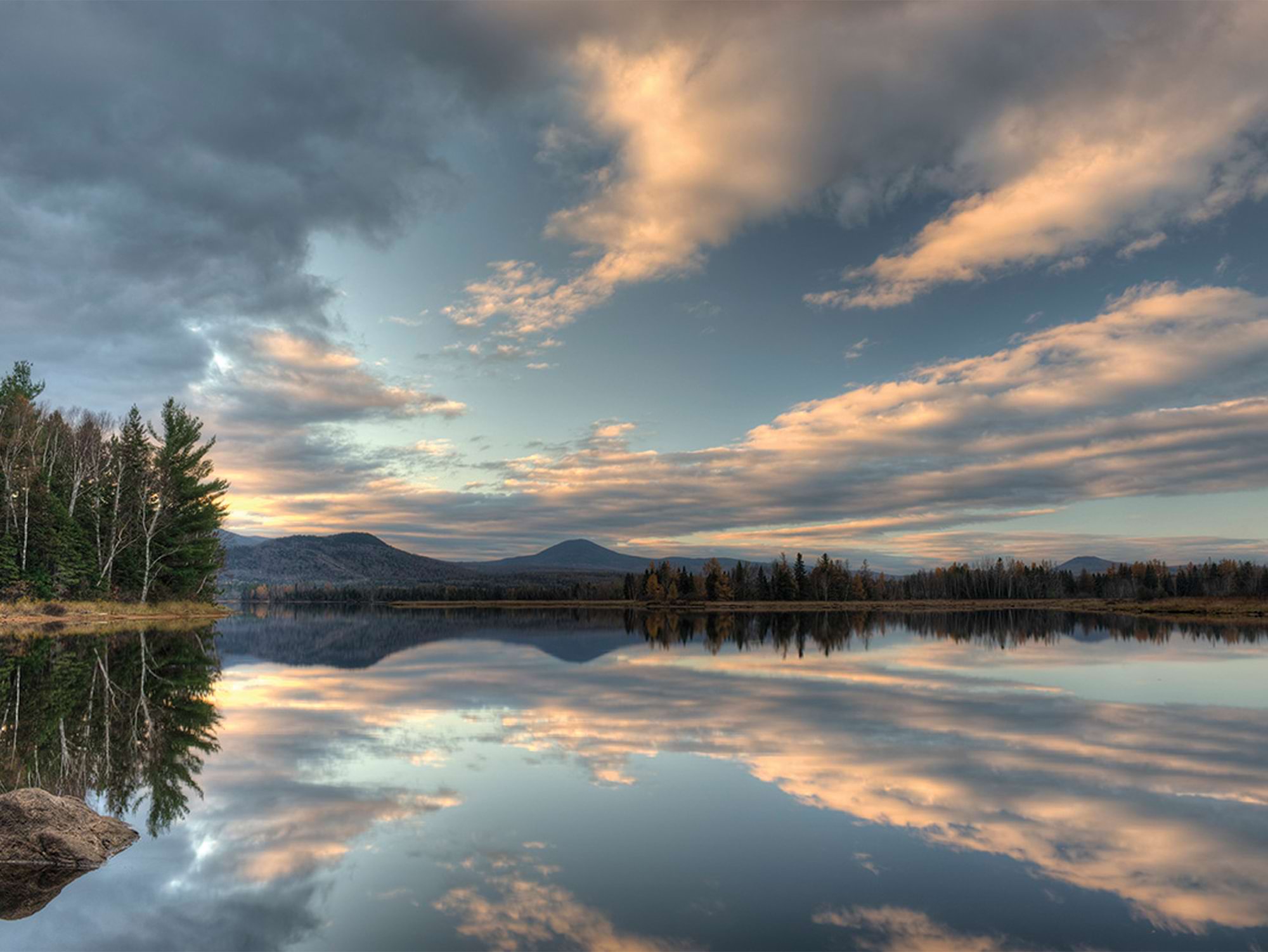 the stark reflection of the sky on Flagstaff Lake, Maine in the early morning