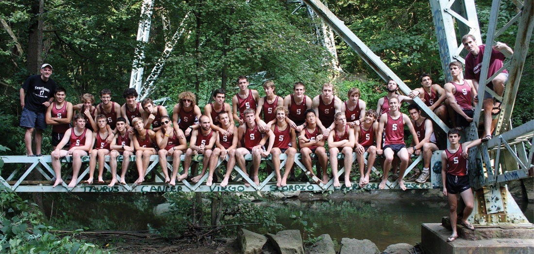 the 2009 Swarthmore Men’s Cross Country Team sitting on a bridge in a group picture