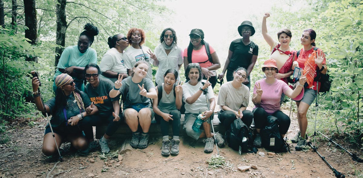 group of female hikers posing for a picture together