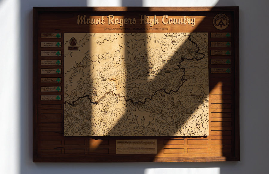 A carved wooden map of the Mount Rogers High Country mounted on a plaque recognizes the generous donors who made the Damascus Trail Center possible