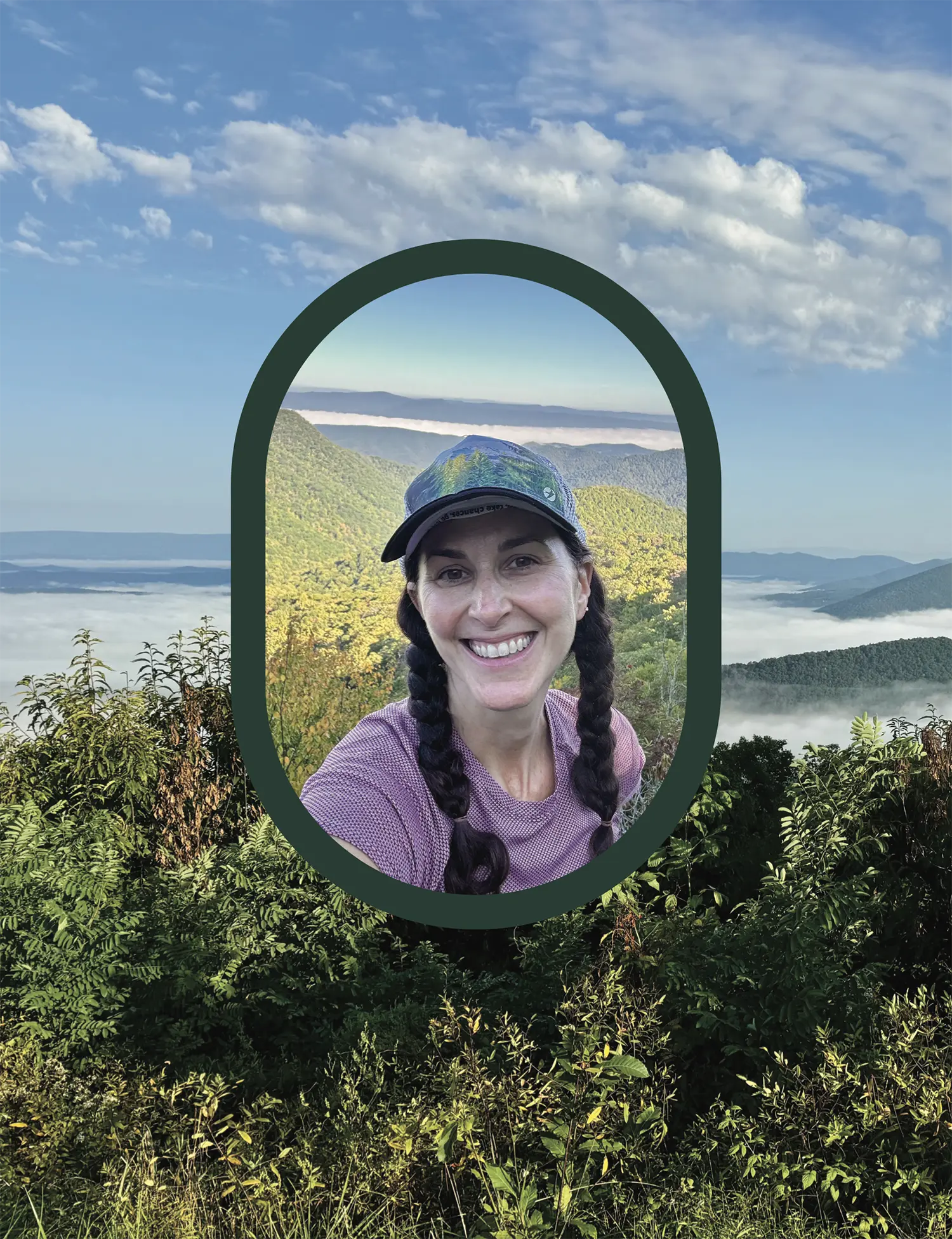 Portrait orientation photograph view of lush greenery bushes all over and rolling green mountains partially covered by fog under a blue sky with clouds acting as a background while in the foreground is a smiling woman with pigtails, a hat, and dark violet t-shirt as her headshot picture is framed within a dark forest green colored curved oval outer stroke shape border