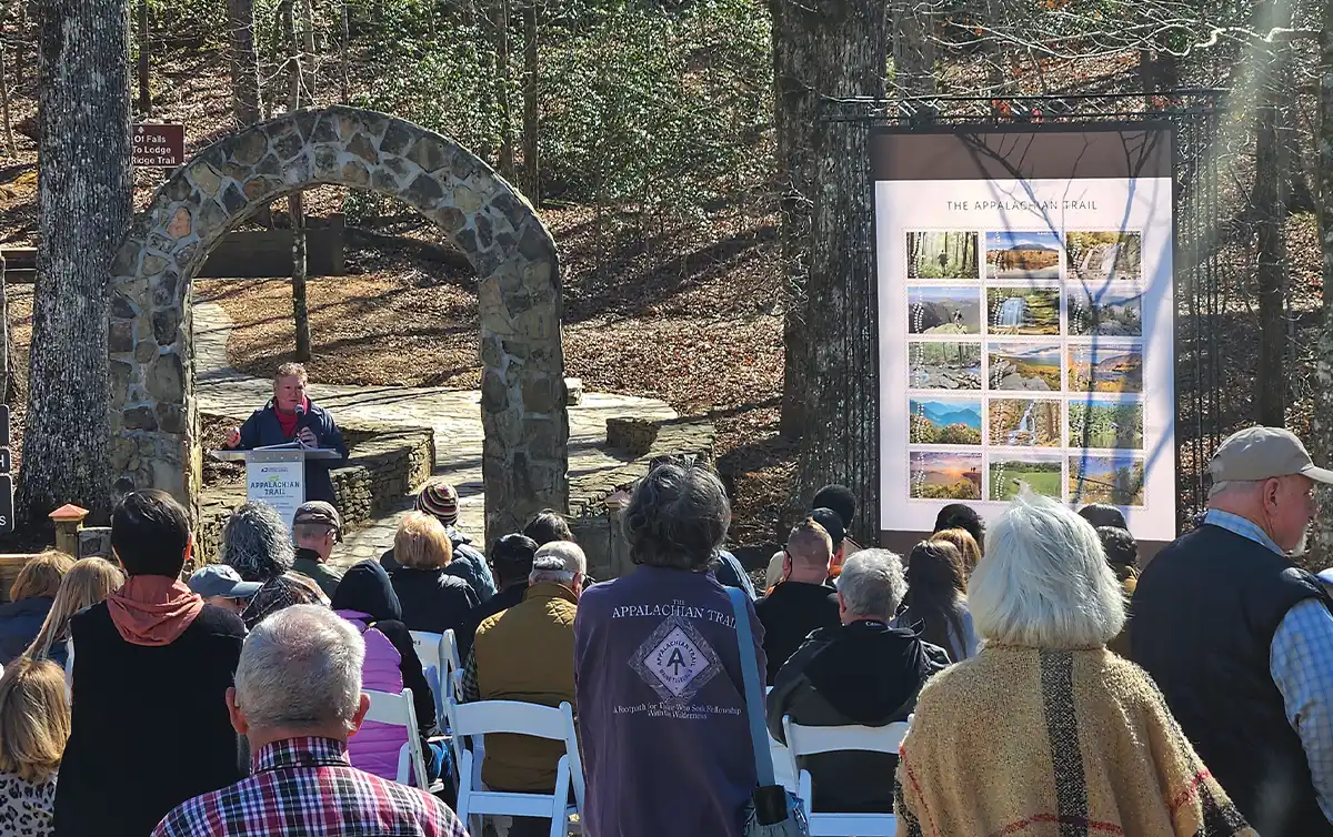 Sandi Marra, ATC president and CEO, speaking during a ceremony outdoors