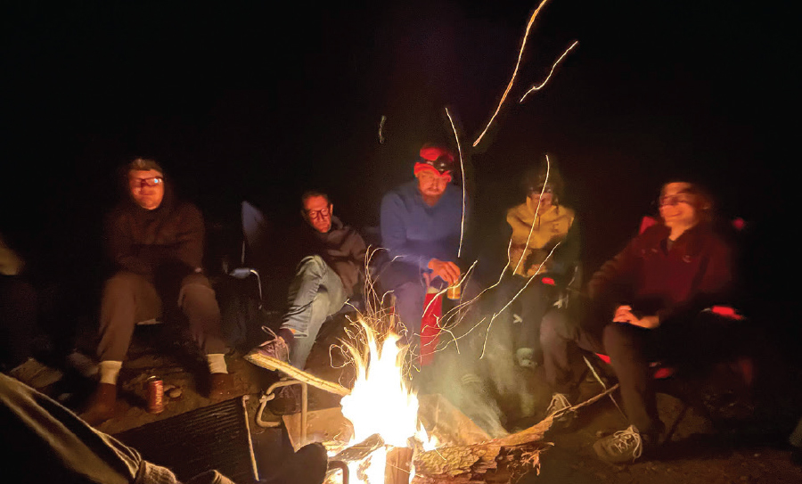 volunteer around campfire