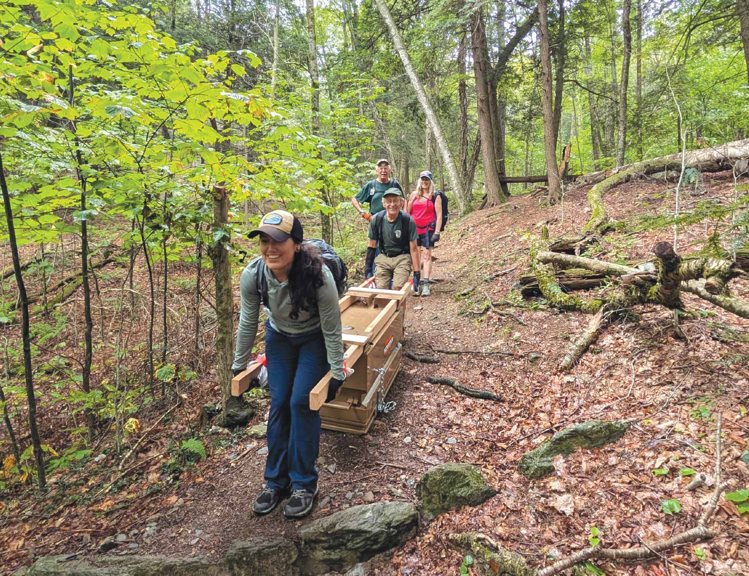 Tracy Lind and  A.T. volunteers carrying bear boxes